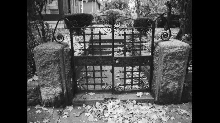 The original stone wall and the wrought iron gate remains on the East 48th street side of the old Charles Hosmer Morse estate. The Richardsonian Romanesque mansion that stood on this wooded lot was demolished in 1931.