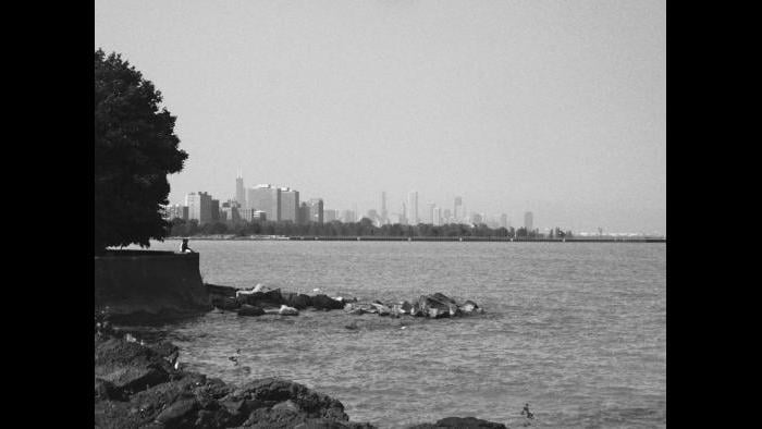 As it did in the aftermath of the great fire, Chicago’s downtown business district has once again experienced a renaissance; today its architecture is renowned worldwide. The city center rises in the distance in this image taken south of Hyde Park’s beloved “Point.” Construction during the ‘30s as an extension of Daniel Burnham’s plan for lakefront improvements, the Point was landscaped by Alfred Caldwell, an architect influenced by Jens Jensen and the concepts of Frank Lloyd Wright.