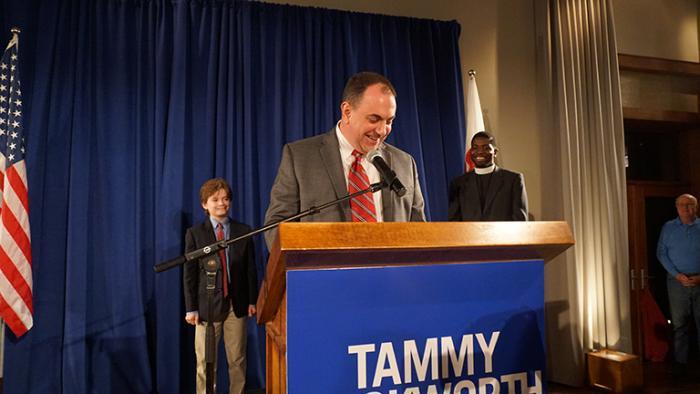 Duckworth's husband, Bryan Bowlsbey, speaks on Tuesday night. (Alex Silets)