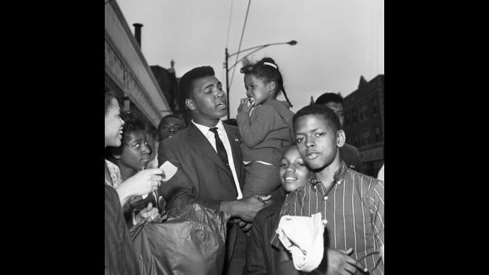 Ali loved a crowd, and often found one on 79th Street in Chicago, near the offices of Muhammad Speaks and the popular Tiger Lounge. (© Lowell K. Riley)  