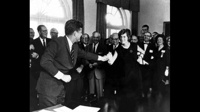 At a bill signing with her brother, President John F. Kennedy. (Courtesy Special Olympics)