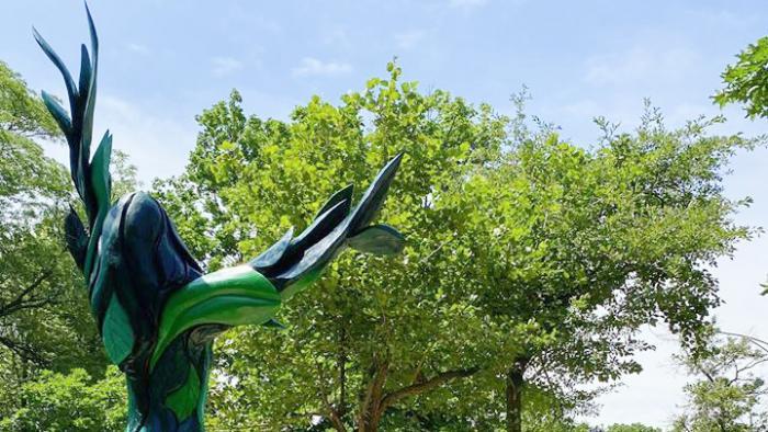 Sculptor Gary Keenan typically leaves his carvings bare to showcase the wood. "Green Lady's" color gives her a different energy, he said. "I think it brings her to life more and grabs people’s attention easier," said Keenan. (Chicago Sculpture International)