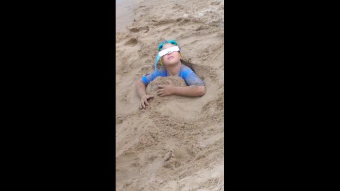 When your brothers bury you in 4 foot hole during eclipse. (Submitted by: CS Russell)