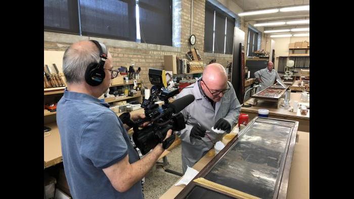 WTTW videographer Tom Siegel films the conservation process of an 18th century Chinese screen.