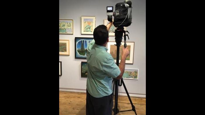 WTTW cameraman Felix Mendez on our shoot at Intuit’s “Chicago Calling” exhibition.