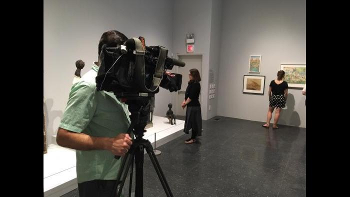 WTTW cameraman Felix Mendez on our shoot at Intuit’s “Chicago Calling” exhibition.