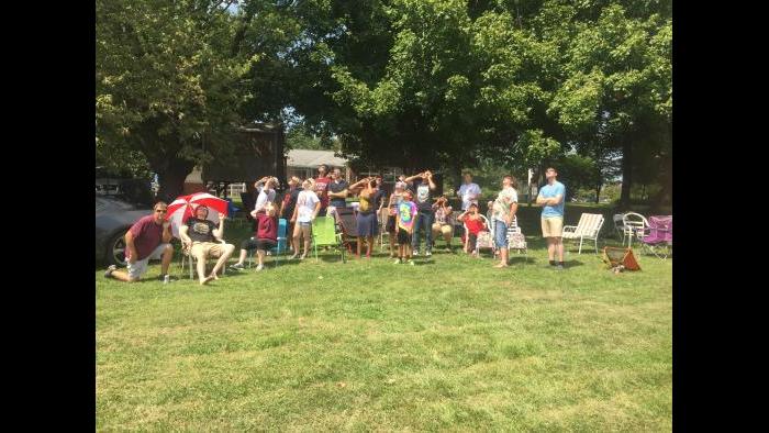 Watching the eclipse from a field in Carbondale. (Elizabeth Brackett / Chicago Tonight)
