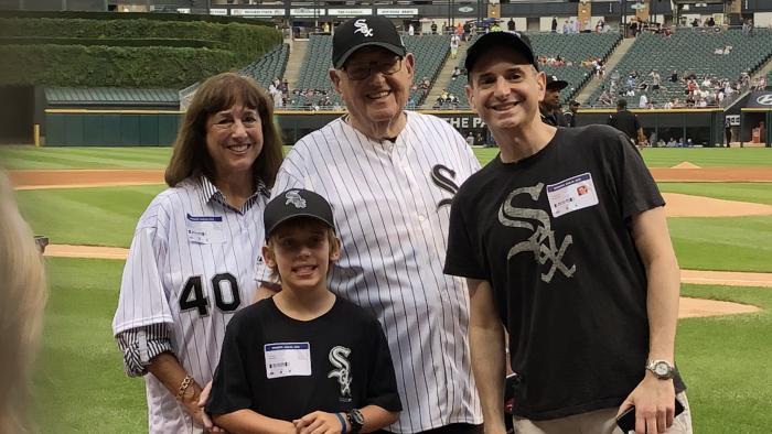 Analee, Holden, Joel and Matthew Weisman on the field Monday, Aug. 6, 2018, before Joel throws out the ceremonial first pitch.