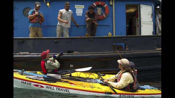 Chatting with a tugboat crew in the Calumet River. (Luke Brodarick / Chicago Tonight)