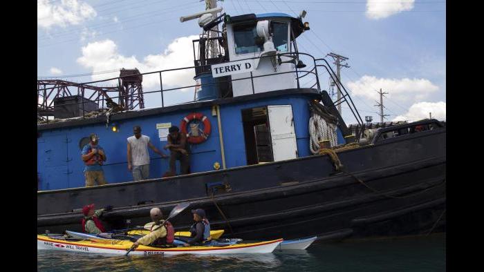 Chatting with a tugboat crew in the Calumet River. (Luke Brodarick / Chicago Tonight)