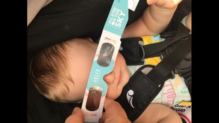 Elora, 9 months old, enjoying her first solar eclipse (Submitted by: Melanie Goldberg)