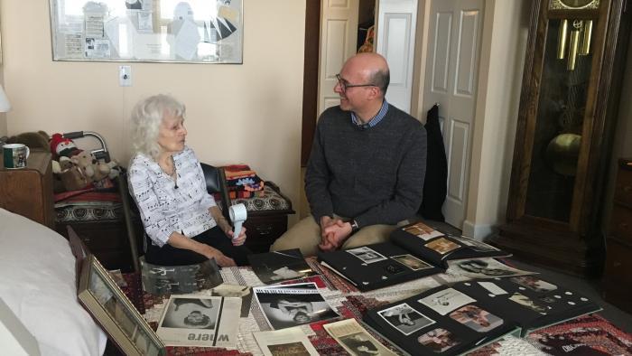Dorothy Olson Pauletti looks though her photo albums with Jay Shefsky.