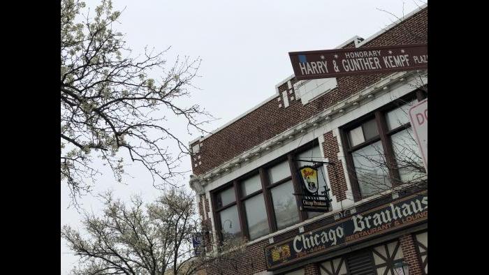 An honorary street sign pays homage to the Kempfs and their legacy in Lincoln Square. (Patty Wetli / WTTW)