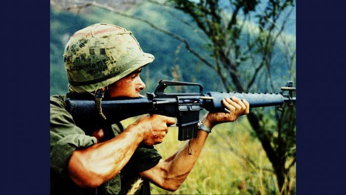 Recon by Fire, 1967. A member of the U.S. Army 101st Airborne Brigade in Quảng Ngãi Province uses his M16 rifle to conduct reconnaissance by fire. Photo by Specialist 5 Robert C. Lafoon, U.S. Army.