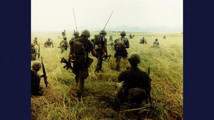 Chasin' Charlie, 1966. Members of the U.S. Army 101st Airborne Brigade prepare to move across a rice field near Tuy Hòa in pursuit of the enemy.Photo by Specialist 5 Robert C. Lafoon, U.S. Army.