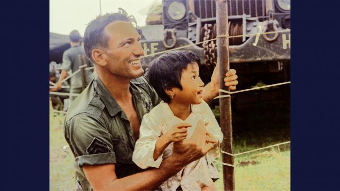 Connecting, 1967. Soldiers of the U.S. Army 1st Infantry Division provide food and medical attention to local villagers near Thuận Giao. Photo by Specialist 5 Robert C. Lafoon, U.S. Army.