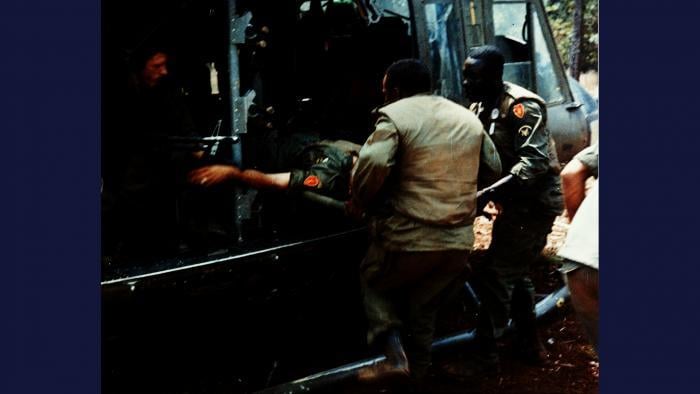 Dustoff, 1966. An executive officer with the U.S. Army 25th Infantry Division is evacuated aboard a 'DUSTOFF' Huey UH-1 air ambulance after receiving a leg wound in a firefight near Pleiku. Photo by Specialist 5 Robert C. Lafoon, U.S. Army.