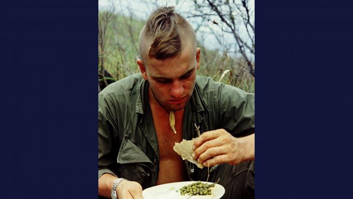 Home Cookin' 1967. A member of the U.S. Army 101st Airborne Division eats his first hot meal in five days after operating in the Quảng Ngãi Province. Photo by Specialist 5 Robert C. Lafoon, U.S. Army.