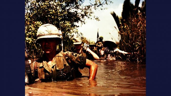 Not a Drop to Drink, 1967. A DASPO motion picture (“mopic”) cameraman accompanies members of the U.S. Army 199th Light Infantry Brigade as they wade through a deep irrigation canal near Cát Lái. Photo by Specialist 5 Robert C. Lafoon, U.S. Army.