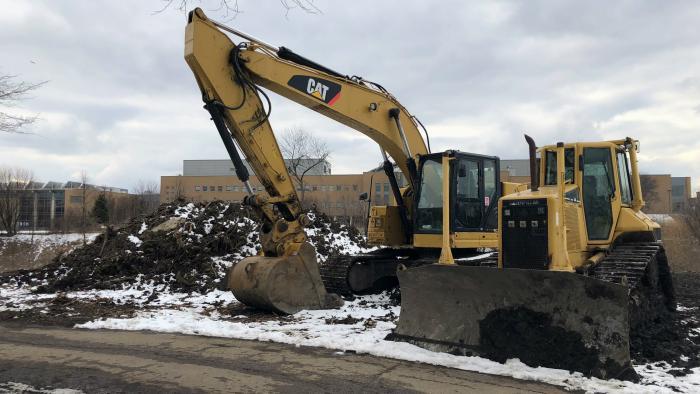 The earth-moving portion of the project in Legion Park is nearly completed. Soil is being trucked to Big Marsh park on Chicago's South Side, where it's being used to remediate land contaminated by industry. (Patty Wetli / WTTW News)