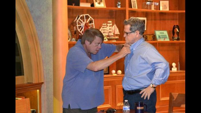 Tim Kazurinsky gets miked up. (Kristen Thometz/Chicago Tonight)