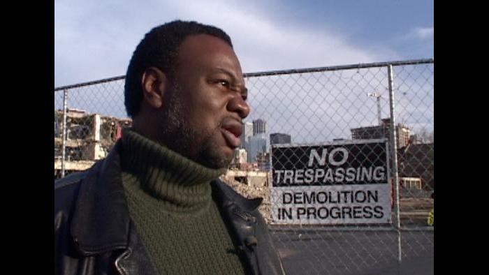 Former Cabrini resident watches the demolition of his building. (Photo by Kevin O'Dowd)