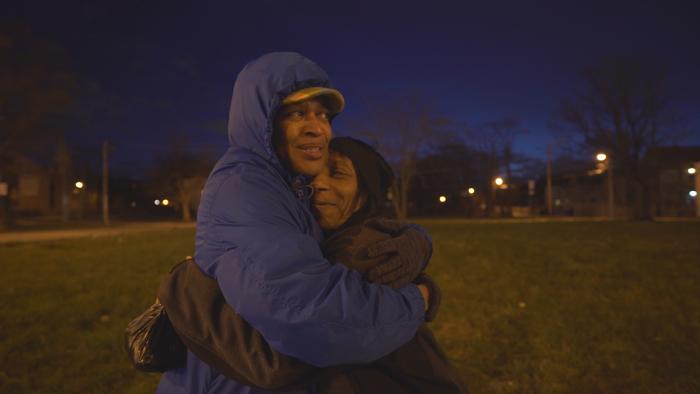Rev.  Faith Miller embraces a woman in the Back of the Yards neighborhood. (Chicago Tonight)