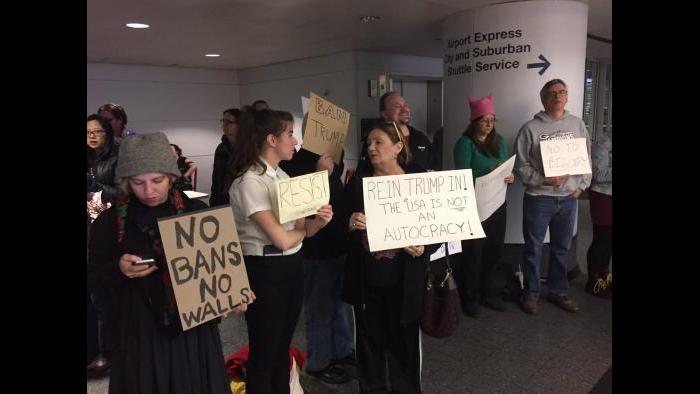 Protesters gather at O’Hare airport Saturday afternoon. (Paris Schutz / Chicago Tonight)