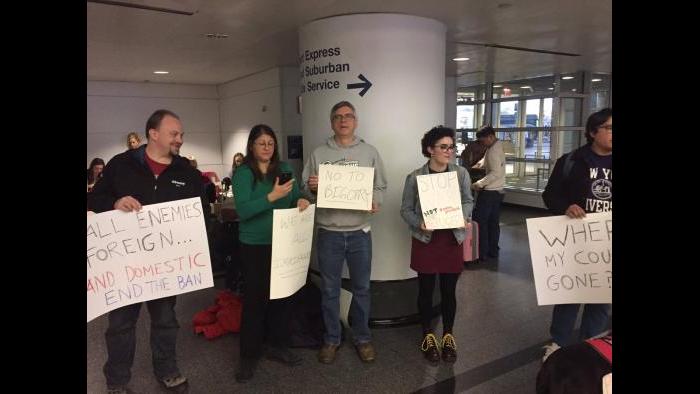 Protesters gather at O’Hare airport Saturday afternoon. (Paris Schutz / Chicago Tonight)