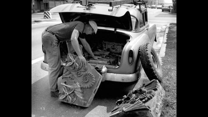 Richard Nickel picks up terra-cotta from the Hammond Library (44 N. Ashland Ave.) on Chicago's West Side in 1963. (Courtesy the Richard Nickel Archive/ Ryerson and Burnham Archives/ The Art Institute of Chicago)