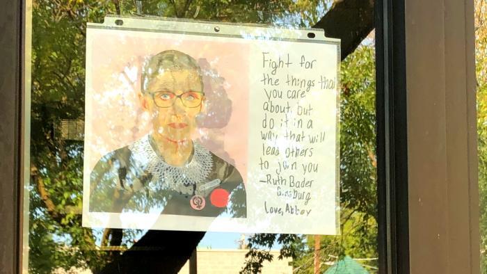 A small memorial for Ruth Bader Ginsburg, outside the Edgewater offices of Cedille Records, owned by the son of the late Supreme Court justice. (Patty Wetli / WTTW News)