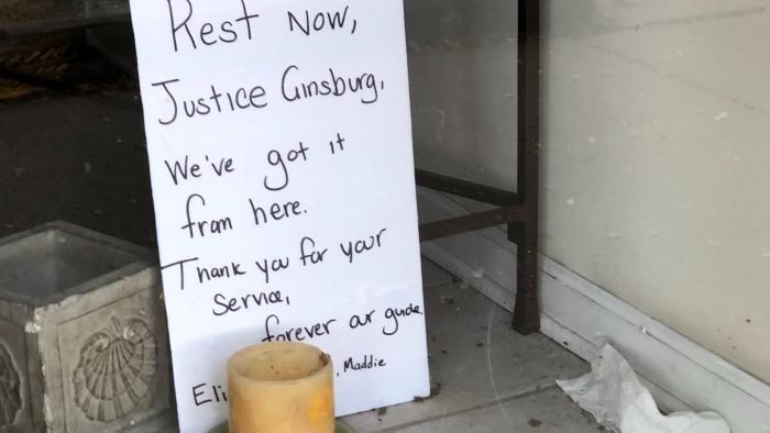 A small memorial for Ruth Bader Ginsburg, outside the Edgewater offices of Cedille Records, owned by the son of the late Supreme Court justice. (Patty Wetli / WTTW News)