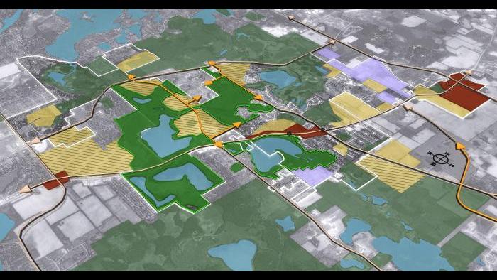 Aerial rendering of key recommendations in the Lakemoor the future land use plan, including conservation neighborhood design, mixed-use town center, and commercial/industrial development.