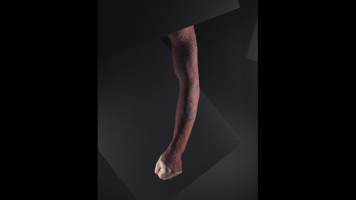Silicone male arm with blacklight tattoo design by Xed Lehead, U.K. (Courtesy of The Field Museum)