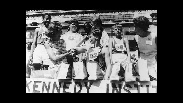 Eunice Kennedy Shriver, left, stands with athletes. She served as director of the Joseph P. Kennedy Foundation, which helped fund the event.  (Courtesy of Special Olympics Chicago)