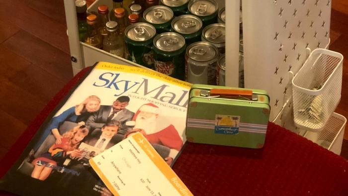 Theme night is all about the details, like faux boarding passes, Sky Mall magazines and an improvised beverage cart. (Courtesy of Heather Payne)