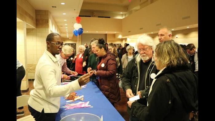 Attendees arrive at the election night event for Lauren Underwood, the Democratic candidate running in Illinois’ 14th Congressional Illinois District. (Evan Garcia / Chicago Tonight)