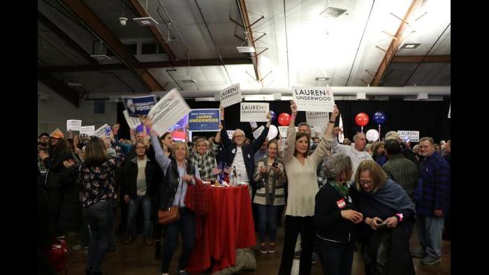Attendees wave signs, preparing for Underwood to reach the stage for her victory speech. (Evan Garcia / Chicago Tonight)