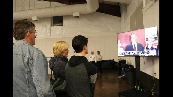 Attendees watch incumbent Republican 14th Congressional District U.S. Rep Randy Hultgren’s concession speech after losing the election to Underwood. (Evan Garcia / Chicago Tonight)