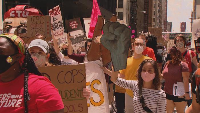 Demonstrators march in Chicago on Wednesday, June 24, 2020 to show their support for removing police officers from schools. (WTTW News)