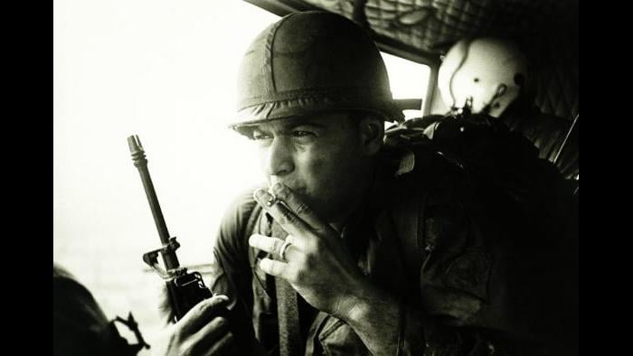 Anticipation, 1968. A Huey UH-1D helicopter carrying members of A Company, 5th Battalion, 7th Cavalry, U.S. Army 1st Air Cavalry Division approaches a landing zone. Photo by Specialist 5 Richard A. “Dick” Durrance, U.S. Army.