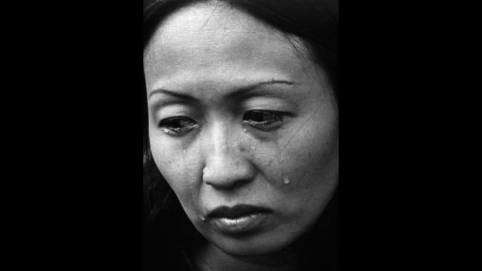 Refugee, 1975. A South Vietnamese refugee cries upon her arrival at Eglin Air Force Base near Valparaiso, Florida. Photo by Specialist 5 Bryan K. Grigsby.