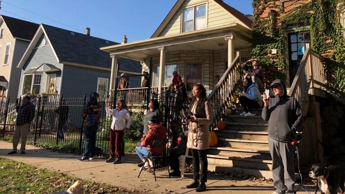 Family, friends, neighbors and media gathered to watch the tree removal. (Patty Wetli / WTTW News)