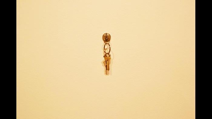 A copy of the apartment keys hung upon hardware at the Weinberg/Newton Gallery. (Maya Miller / Chicago Tonight)