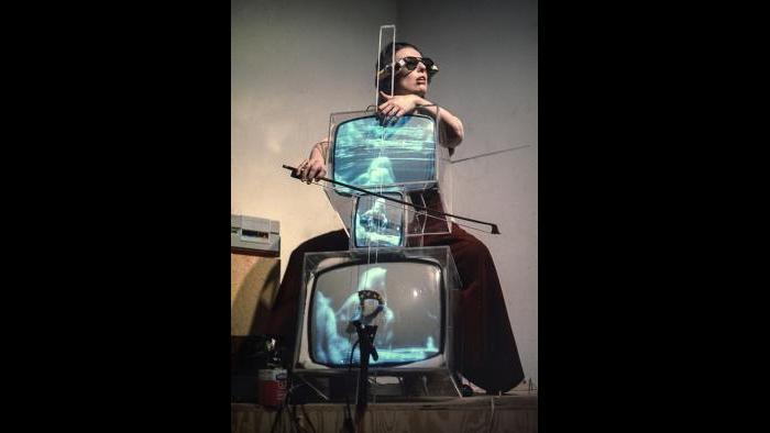 Charlotte Moorman performs Nam June Paik’s TV Cello wearing TV Glasses, New York, 1971.  (© Takahiko iimura.)