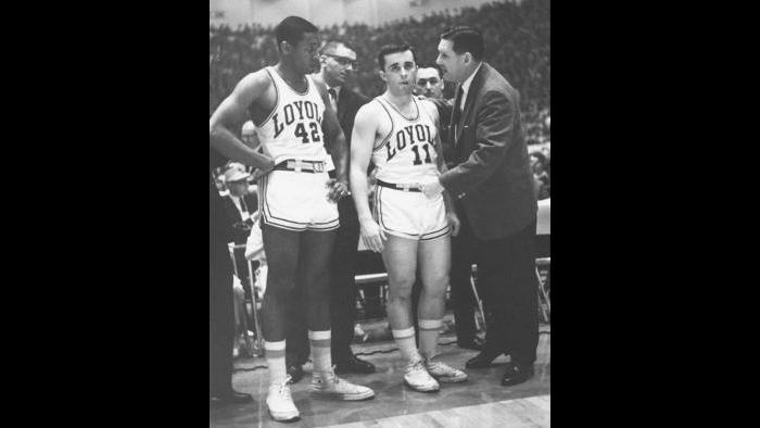 Loyola coach George Ireland talks to Ron Miller, left, and Johnny Eagan during 1963 game.