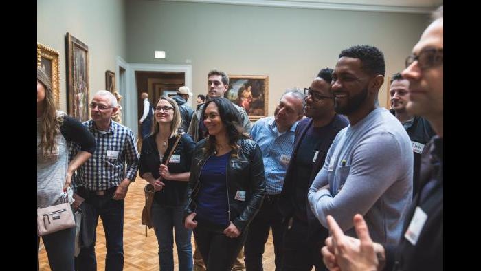 FitzGerald Associates Architects staff smile as they hear about a piece at the Art Institute while on a Museum Hack tour. (Courtesy of Museum Hack)