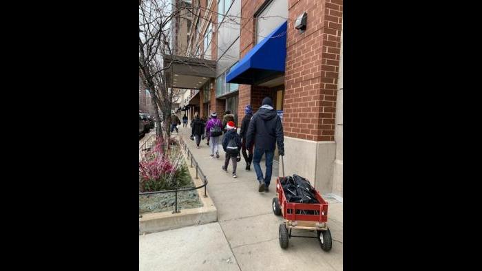 A family delivers care packages in the South Loop on Saturday. (Photo: Monita Eng-Milton)