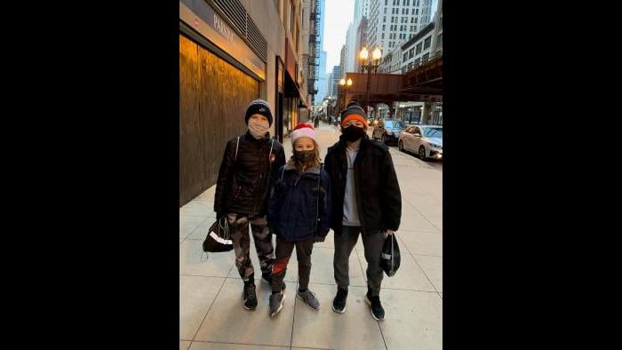 Children pose for a photo while delivering care packages in the South Loop on Saturday. (Photo: Monita Eng-Milton)