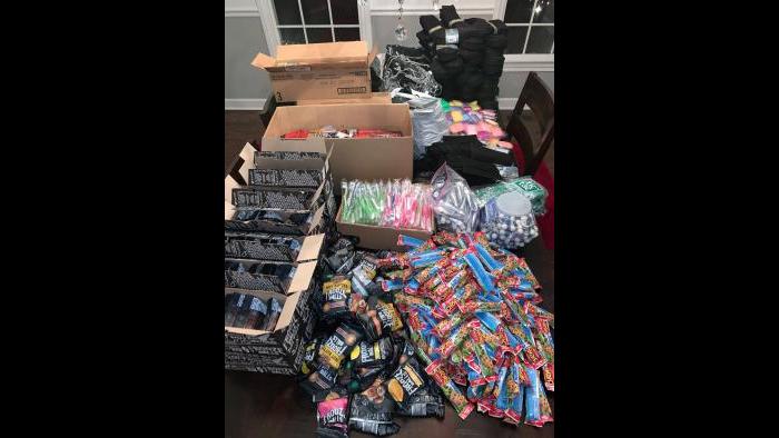 Families helped prepare the care packages earlier this week with essential food and hygiene items. (Photo: Monita Eng-Milton)